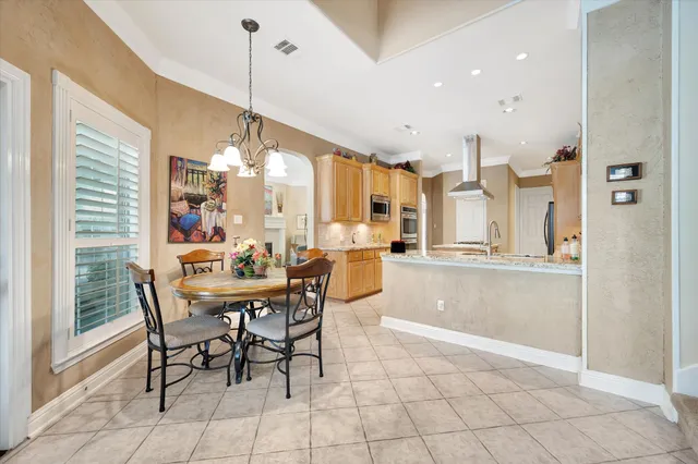 a dining room filled with furniture and window