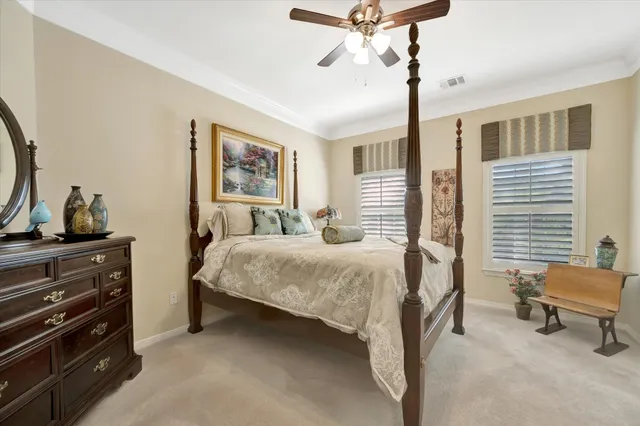 a bedroom with bed and window