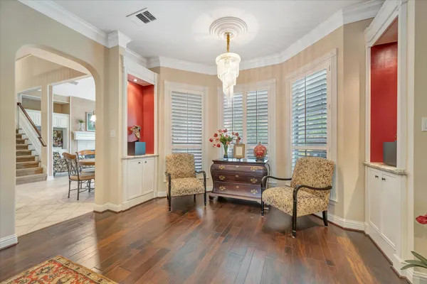 a spacious bedroom with a bed and ceiling fan