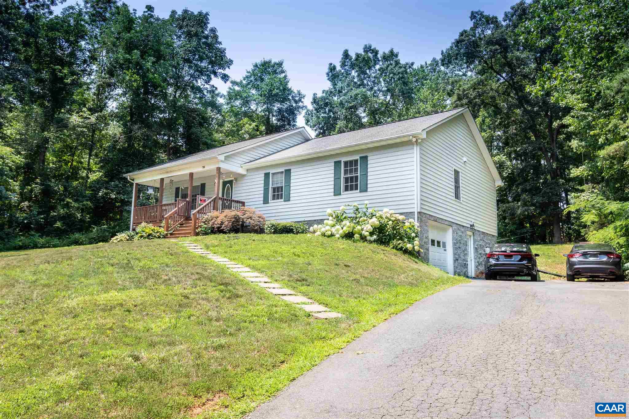 196 Logtrac Road Stanardsville, VA 22973 - Photo 1 of 34 a view of a house with garden and trees
