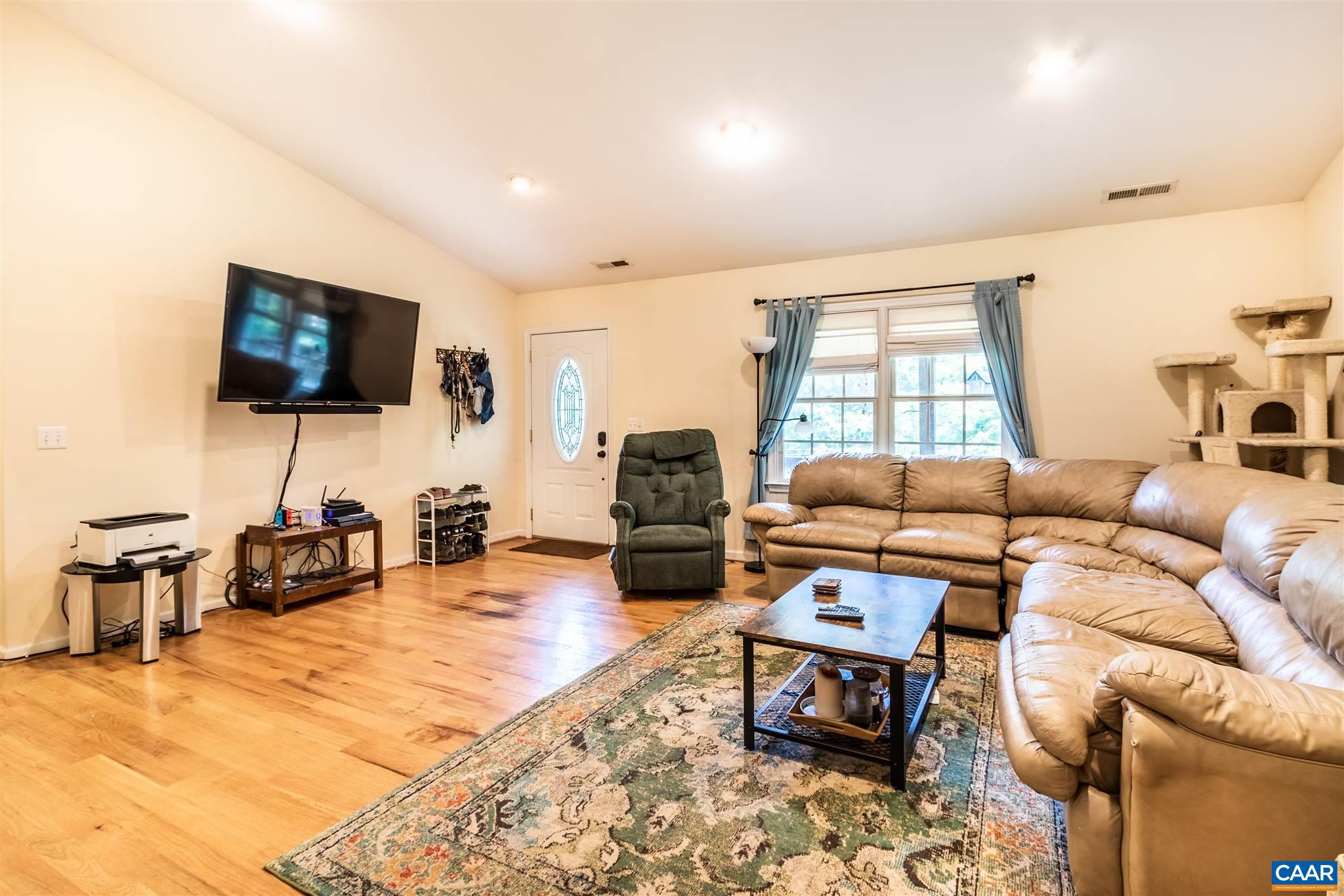 196 Logtrac Road Stanardsville, VA 22973 - Photo 18 of 34 a living room with furniture and a flat screen tv