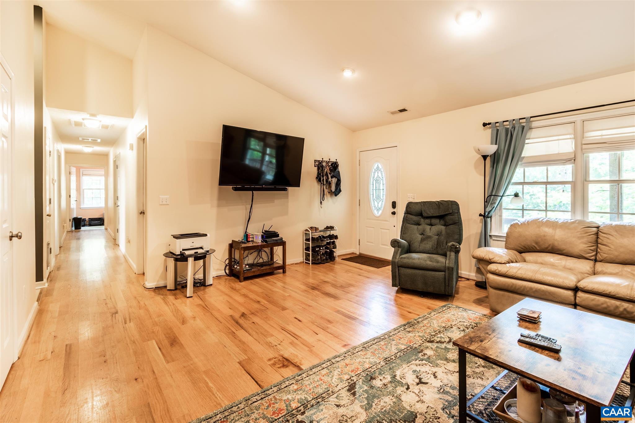 196 Logtrac Road Stanardsville, VA 22973 - Photo 19 of 34 a living room with furniture and a flat screen tv