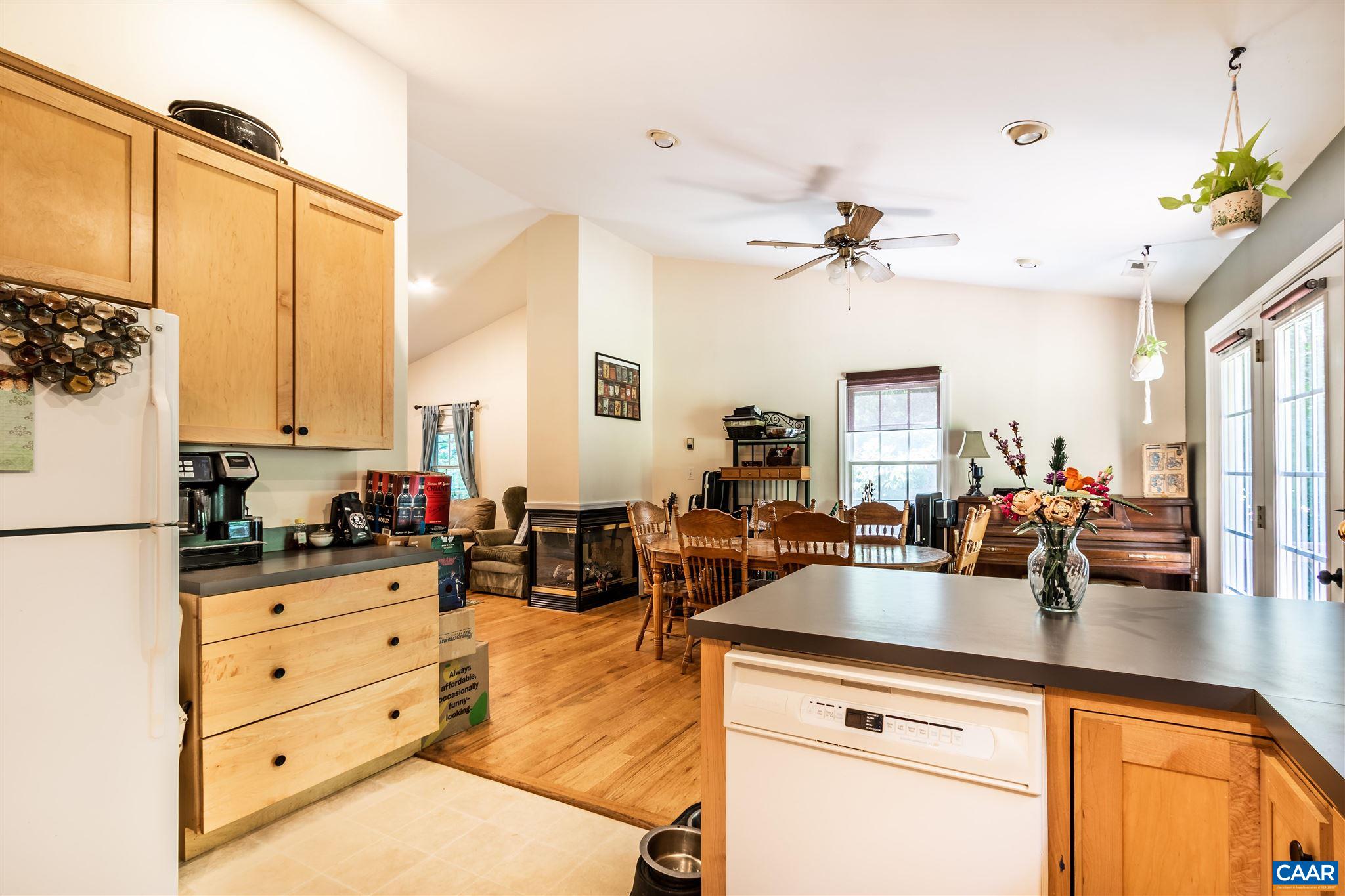 196 Logtrac Road Stanardsville, VA 22973 - Photo 23 of 34 a kitchen with granite countertop a sink a stove and cabinets