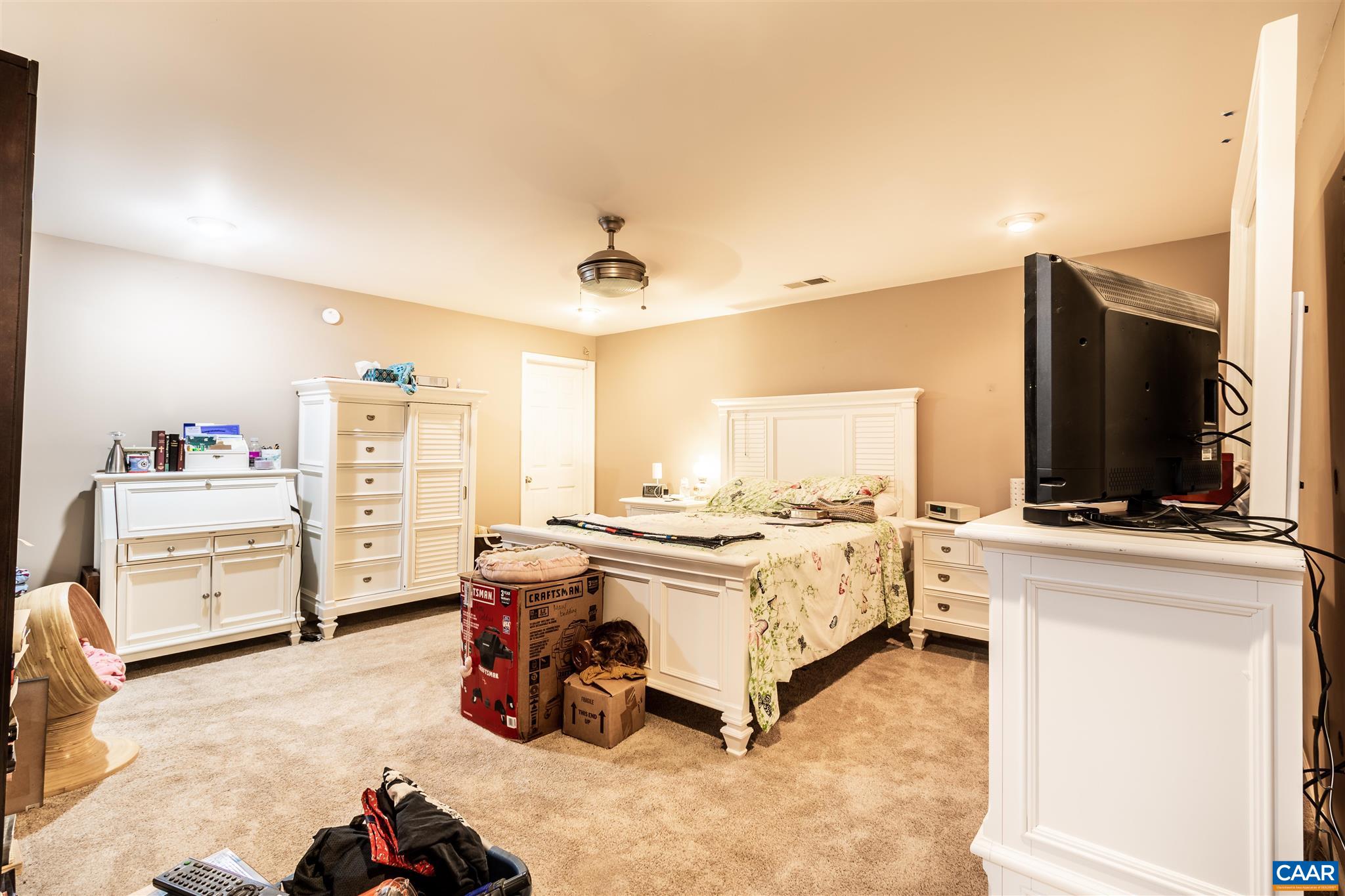 196 Logtrac Road Stanardsville, VA 22973 - Photo 9 of 34 a view of a bedroom with furniture and flat screen tv