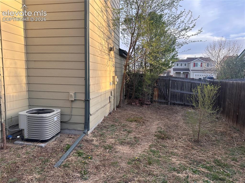 628 Prairie Star Circle Colorado Springs, CO 80916 - Photo 36 of 37 Side yard with air conditioner