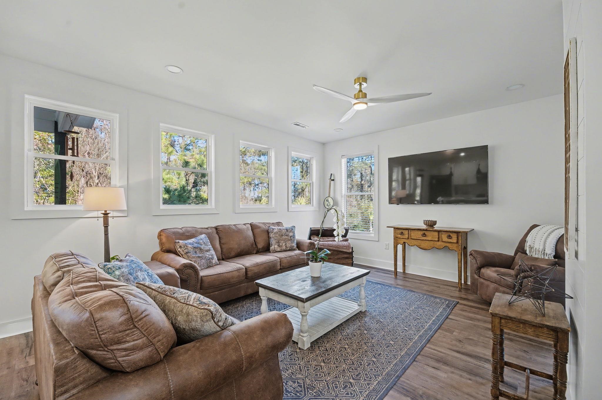 236 Brown Pelican Loop Pawleys Island, SC 29585 - Photo 16 of 38 Living room with wood finished floors, ceiling fan, and recessed lighting