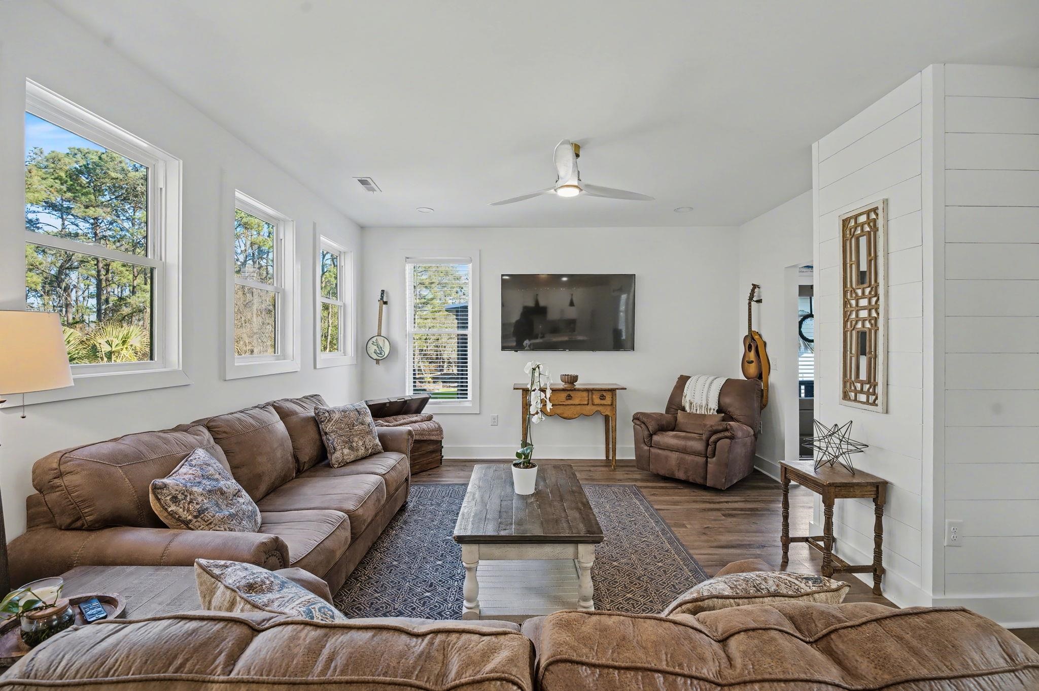 236 Brown Pelican Loop Pawleys Island, SC 29585 - Photo 17 of 38 Living area featuring wood finished floors and ceiling fan
