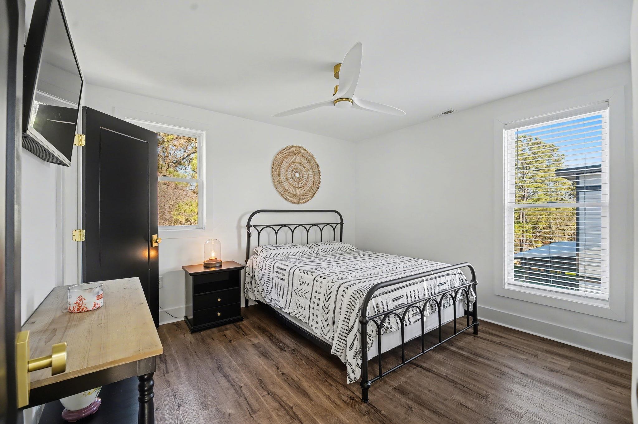 236 Brown Pelican Loop Pawleys Island, SC 29585 - Photo 32 of 38 Secondary Bedroom with a ceiling fan, and multiple windows
