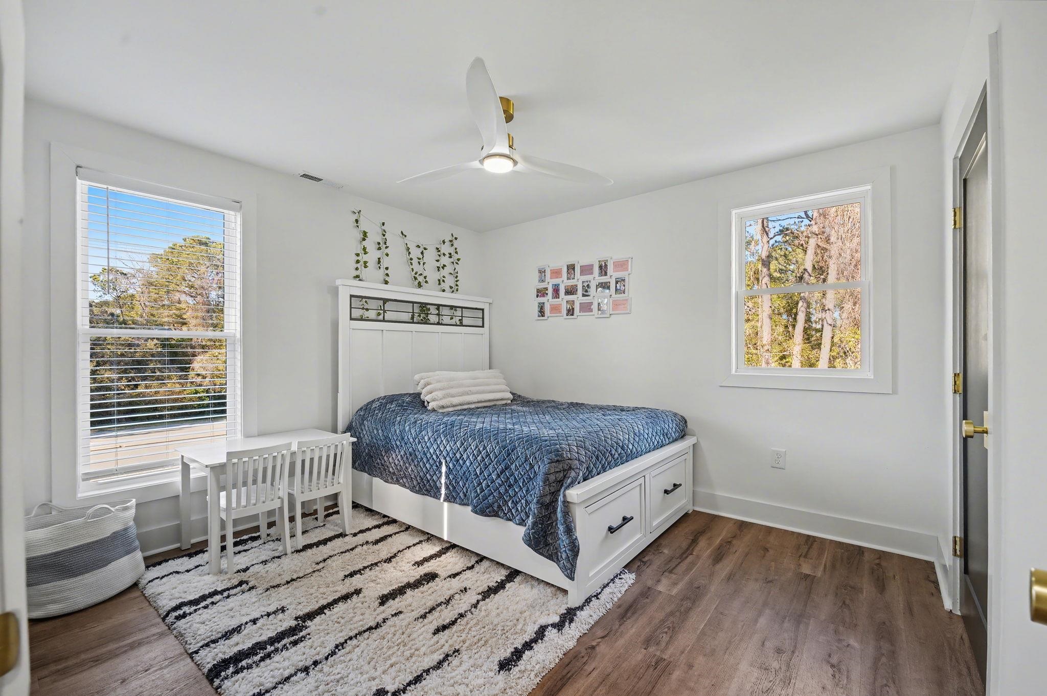 236 Brown Pelican Loop Pawleys Island, SC 29585 - Photo 34 of 38 Guest Bedroom a ceiling fan, and multiple windows