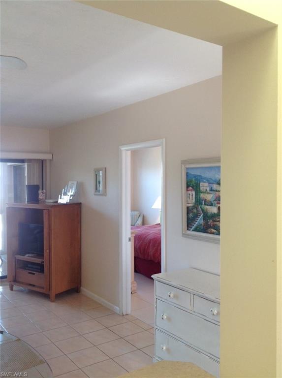 803 River Point Drive, Unit 202B Naples, FL 34102 - Photo 21 of 24 a view of dining room with furniture and lamp