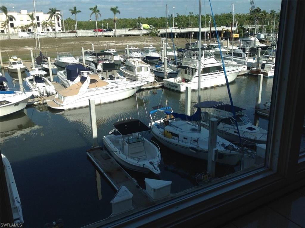 803 River Point Drive, Unit 202B Naples, FL 34102 - Photo 7 of 24 a view of a lake from a balcony