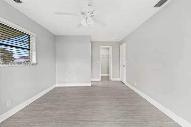 a view of an empty room with a window