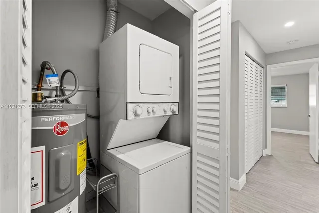 a view of storage and utility room with washer and dryer