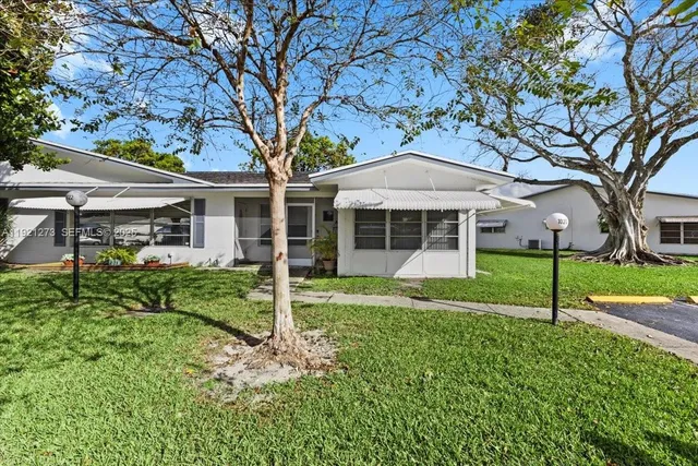 front view of a house with a yard