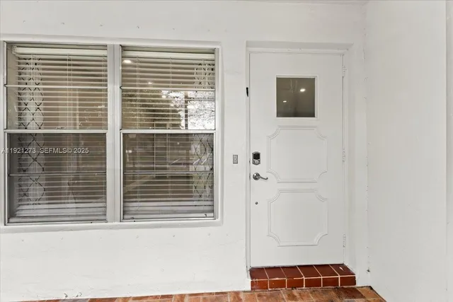 a view of a door and a window