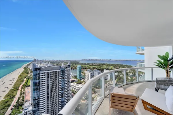 a view of balcony with furniture