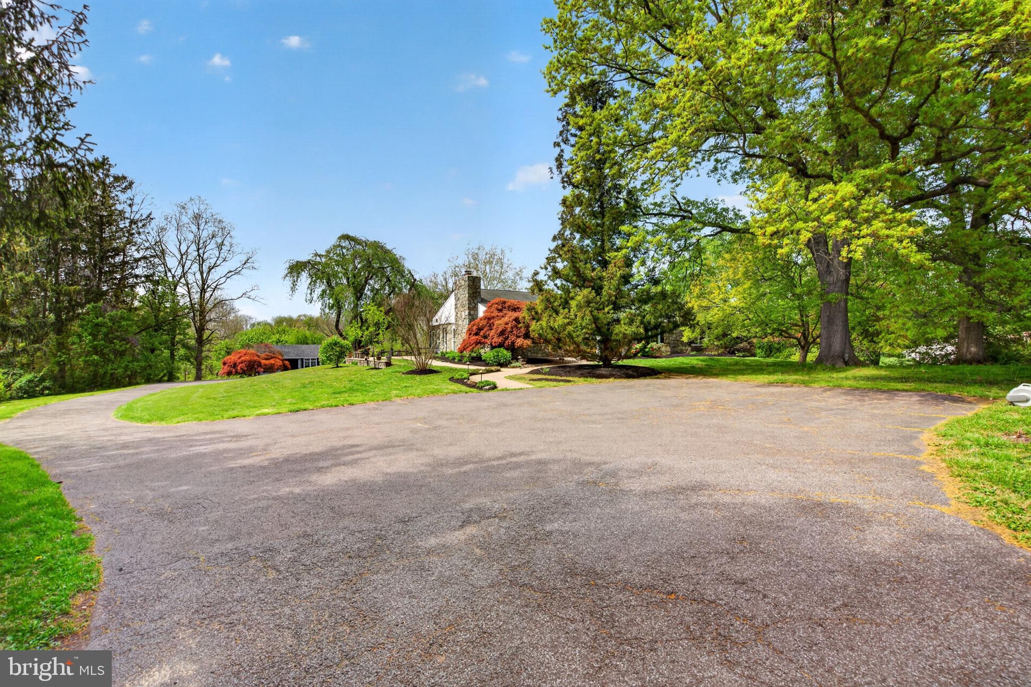 300 Sanatoga Road Pottstown, PA 19465 - Photo 54 of 79 Charming driveway amidst lush greenery.