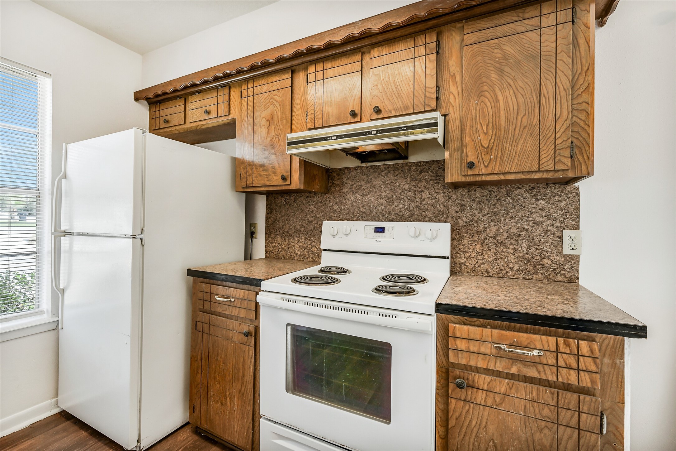 217 Lazy Lane Conroe, TX 77301 - Photo 13 of 28 a kitchen with stainless steel appliances granite countertop a refrigerator and a stove