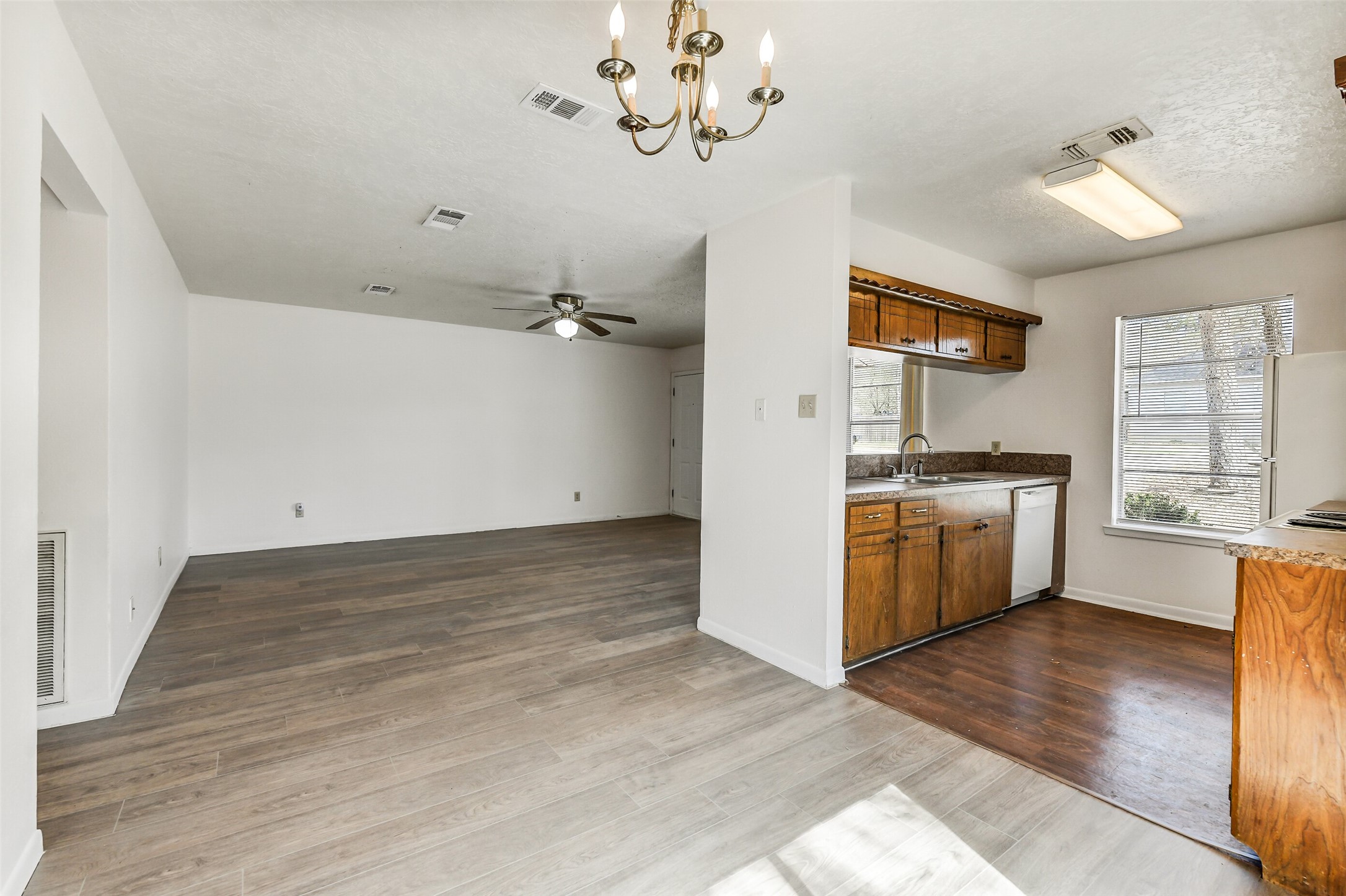 217 Lazy Lane Conroe, TX 77301 - Photo 16 of 28 a view of a kitchen with a sink cabinets and wooden floor