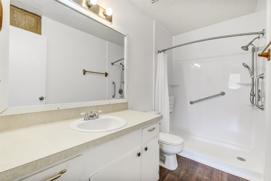 217 Lazy Lane Conroe, TX 77301 - Photo 19 of 28 a bathroom with a sink toilet tub and shower