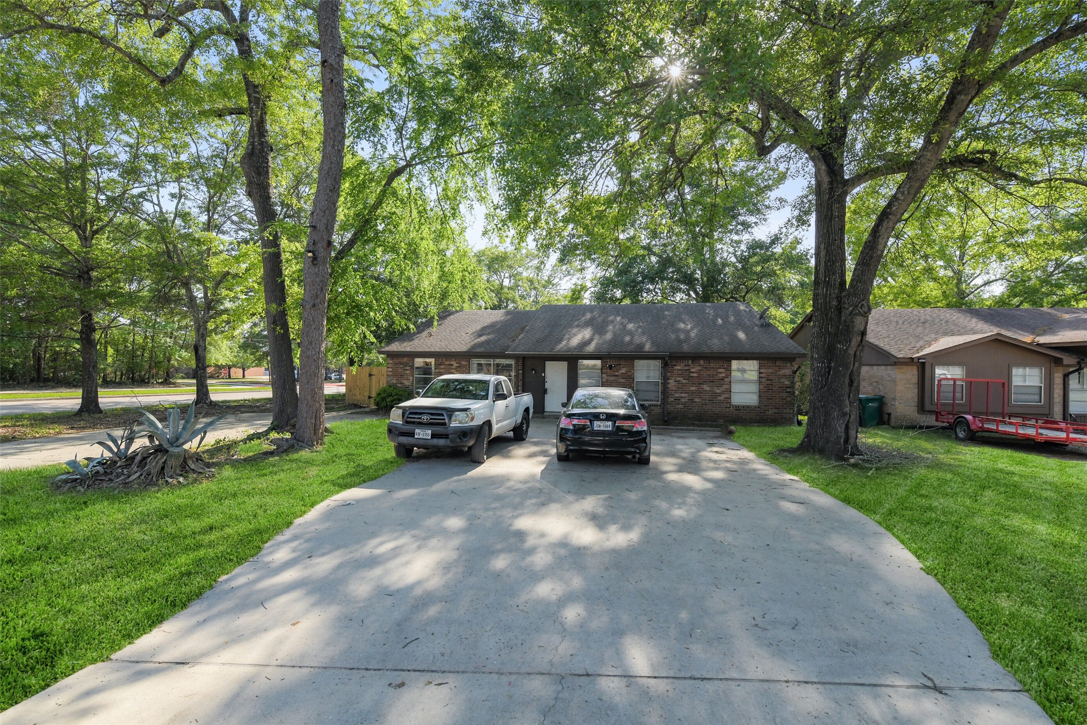 217 Lazy Lane Conroe, TX 77301 - Photo 2 of 28 a view of a house with backyard and sitting area