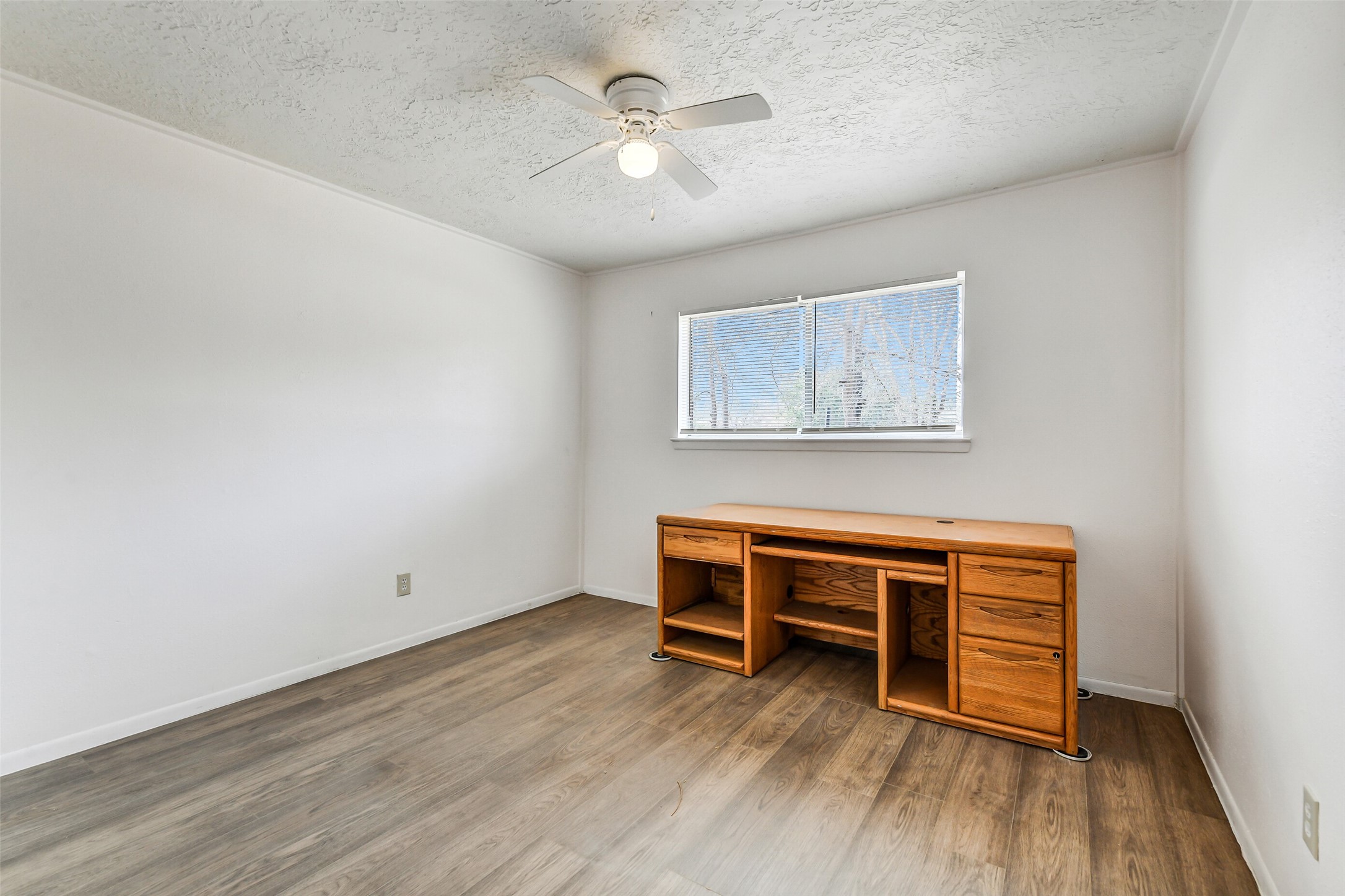 217 Lazy Lane Conroe, TX 77301 - Photo 22 of 28 a view of room with wooden floor and ceiling fan