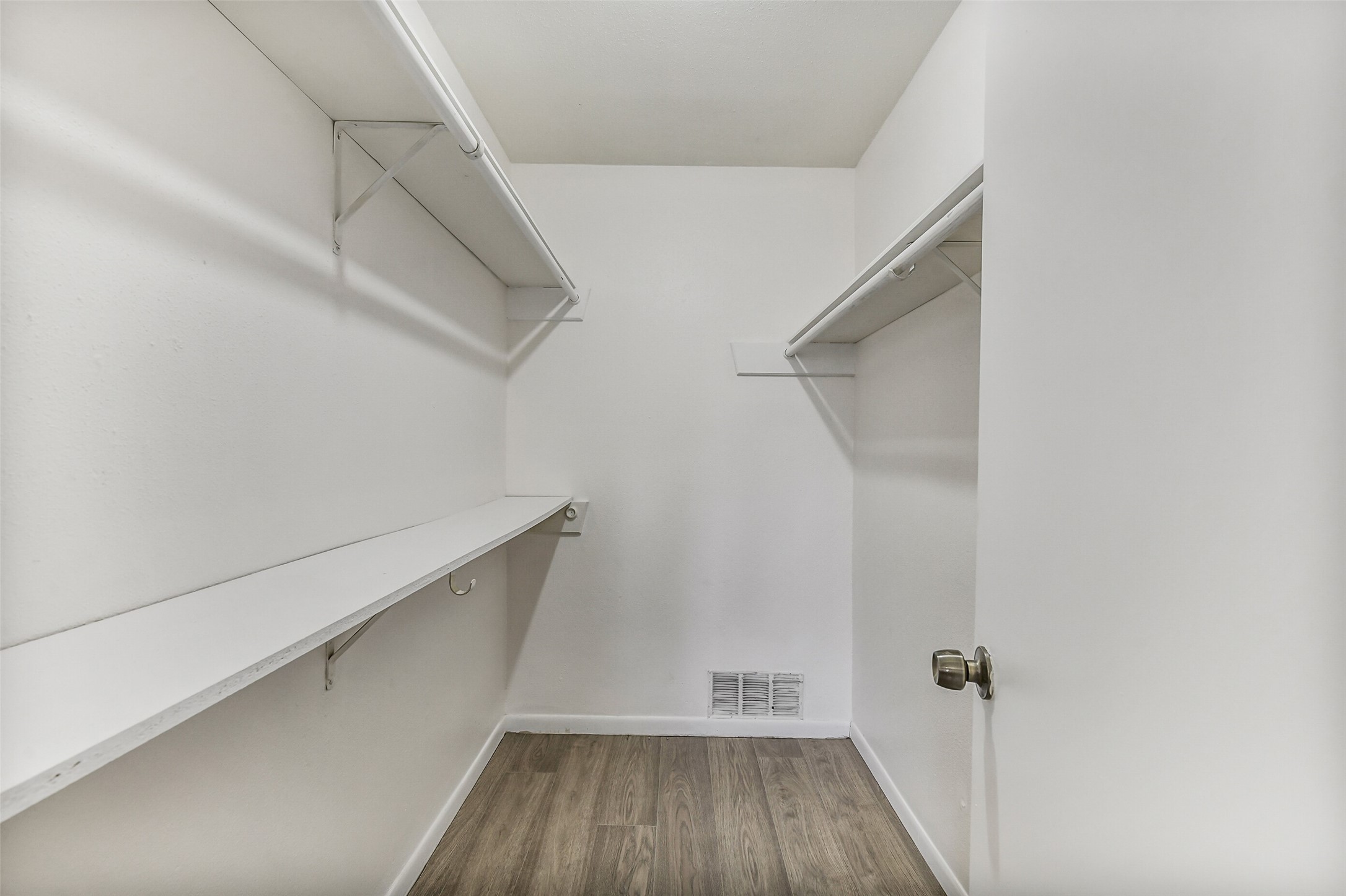 217 Lazy Lane Conroe, TX 77301 - Photo 24 of 28 a view of walk in closet with wooden floor