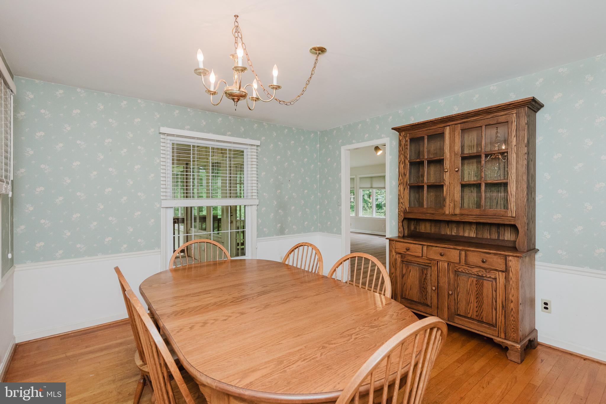 3622 Miller Road Street, MD 21154 - Photo 11 of 48 a spacious bedroom with a bed and a dresser next to a window