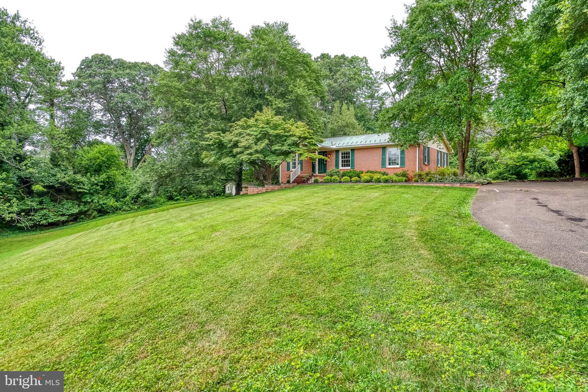 3622 Miller Road Street, MD 21154 - Photo 2 of 48 a front view of a house with a garden