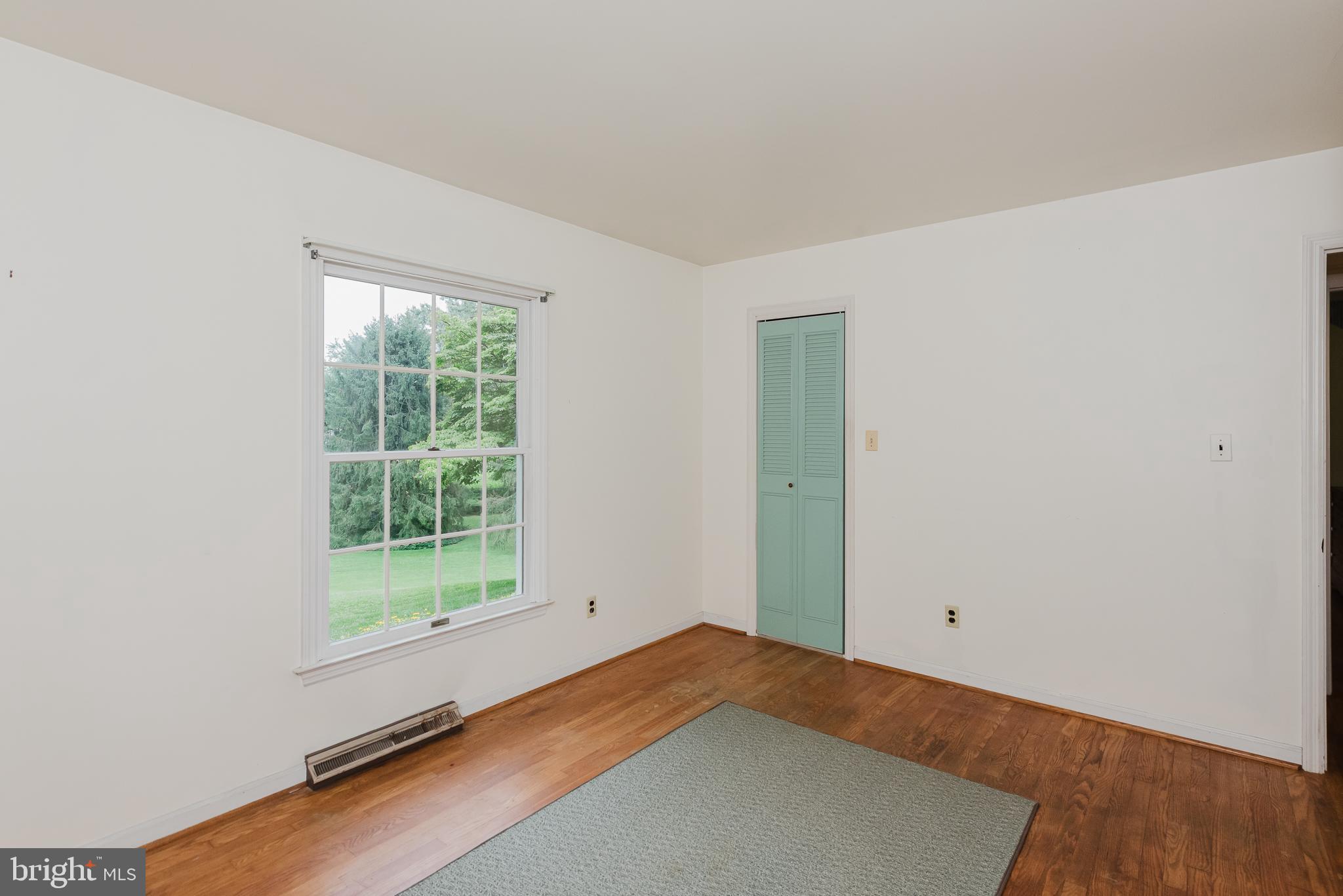 3622 Miller Road Street, MD 21154 - Photo 25 of 48 an empty room with wooden floor and windows