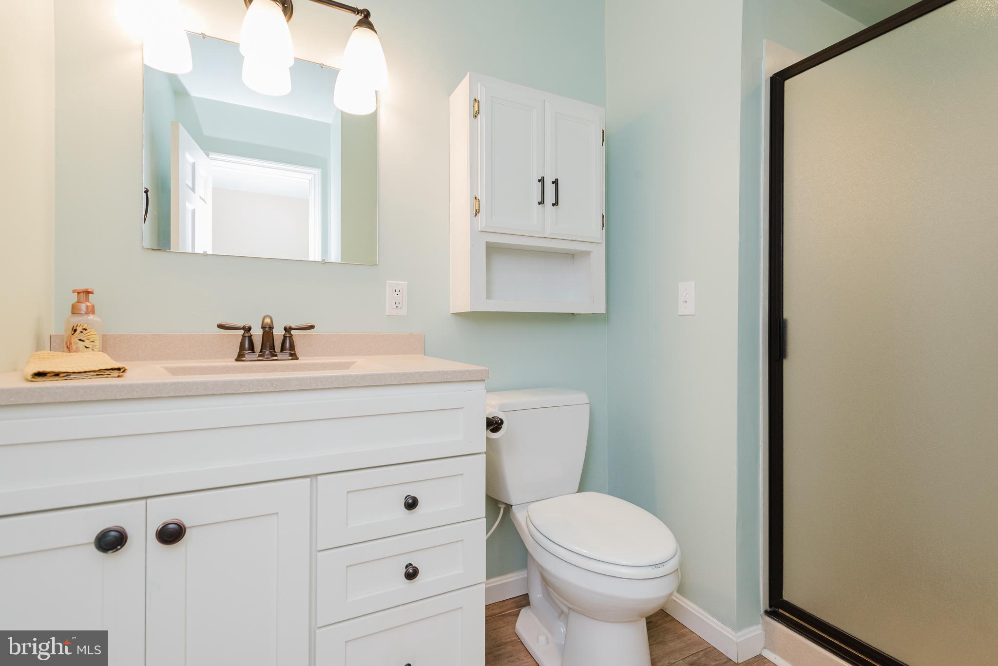 3622 Miller Road Street, MD 21154 - Photo 26 of 48 a bathroom with a sink a toilet and mirror
