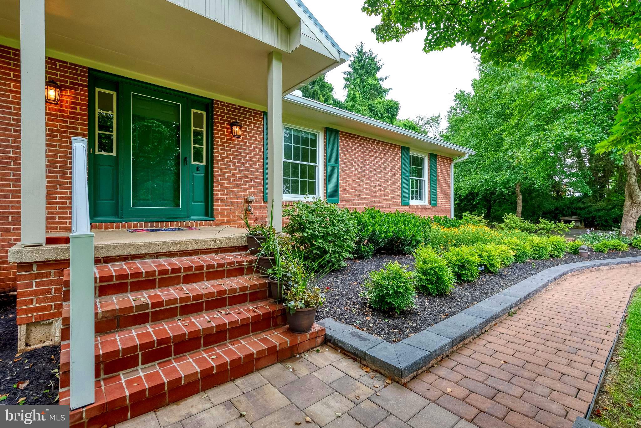 3622 Miller Road Street, MD 21154 - Photo 4 of 48 a front view of a house with a garden
