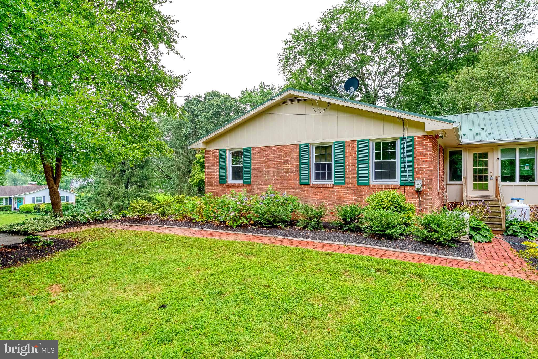 3622 Miller Road Street, MD 21154 - Photo 46 of 48 a front view of a house with a yard and trees