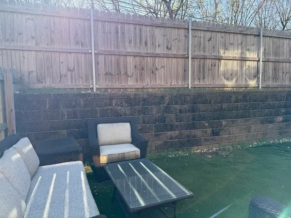 a view of a bench in back yard