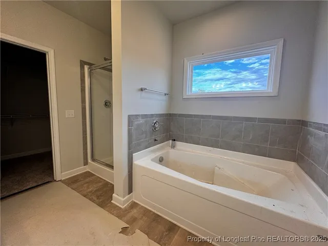 a white bath tub sitting next to a window