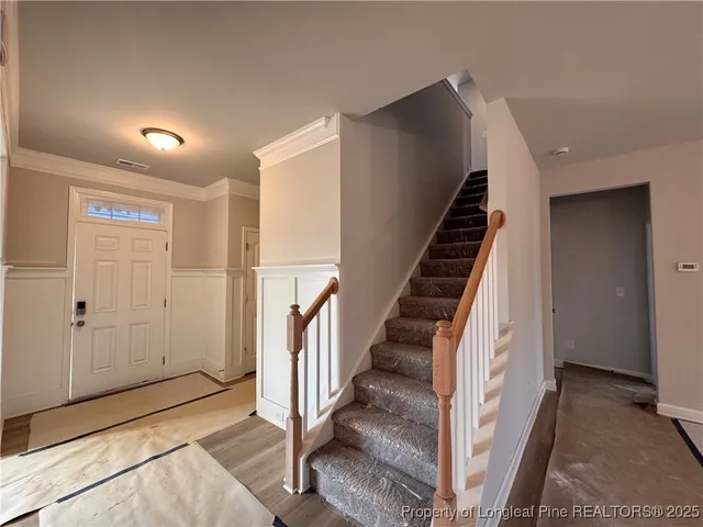 a view of an entryway with stairs