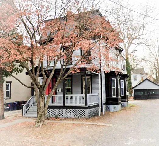 a view of a house with a tree