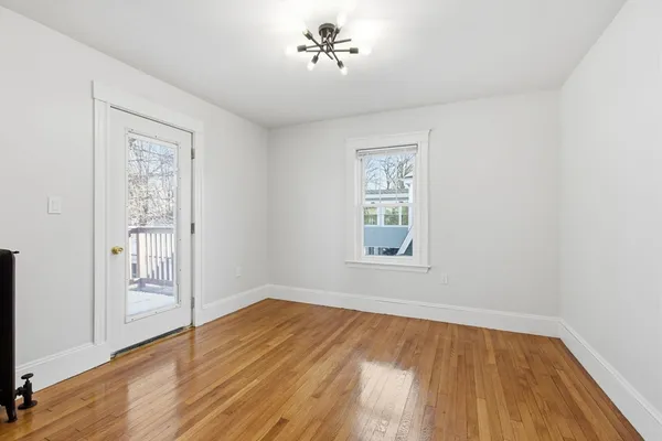 a view of entryway with wooden floor