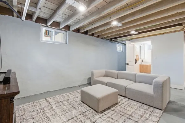 a bathroom with a toilet a sink and a mirror