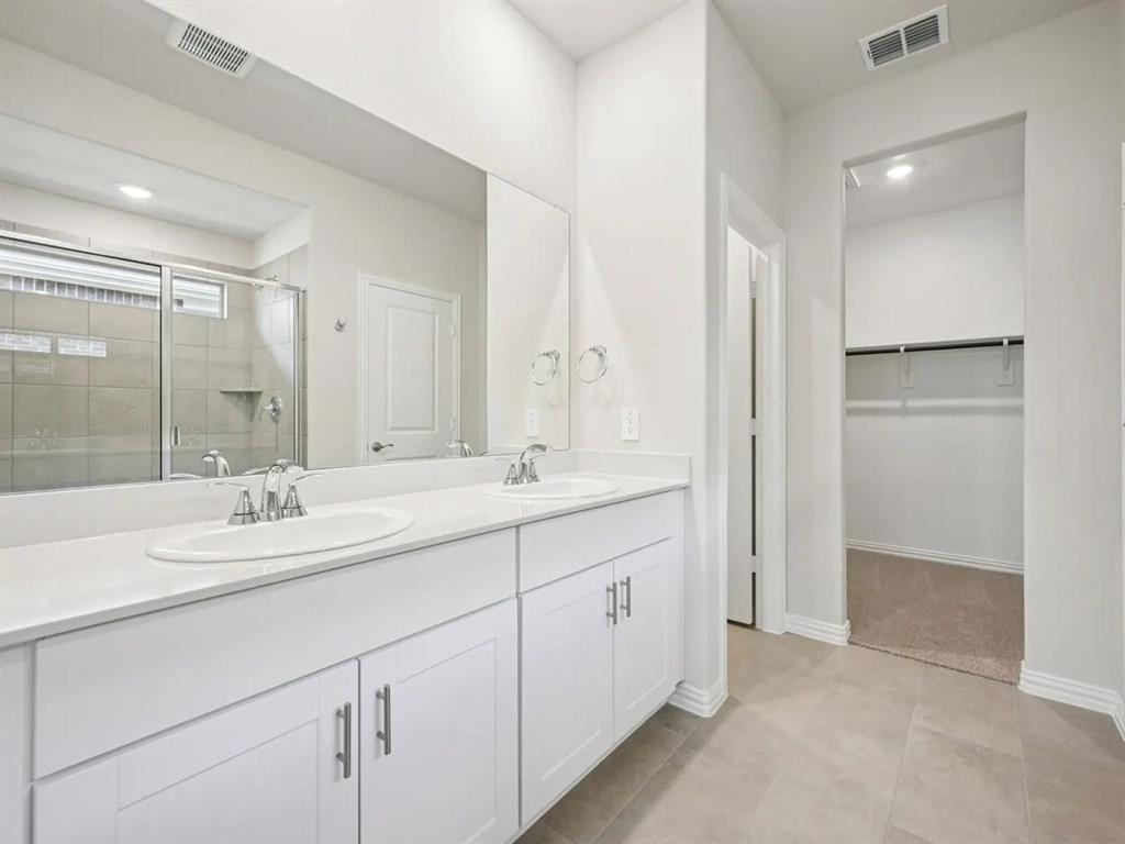 6400 Texas Ranger Trail Fort Worth, TX 76123 - Photo 8 of 14 a bathroom with double sink and a mirror