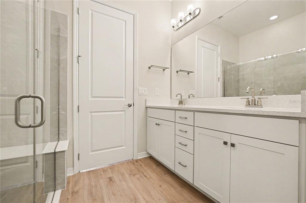 1991 Key Bay Trail Kissimmee, FL 34747 - Photo 14 of 31 a spacious bathroom with a double vanity sink a mirror and shower