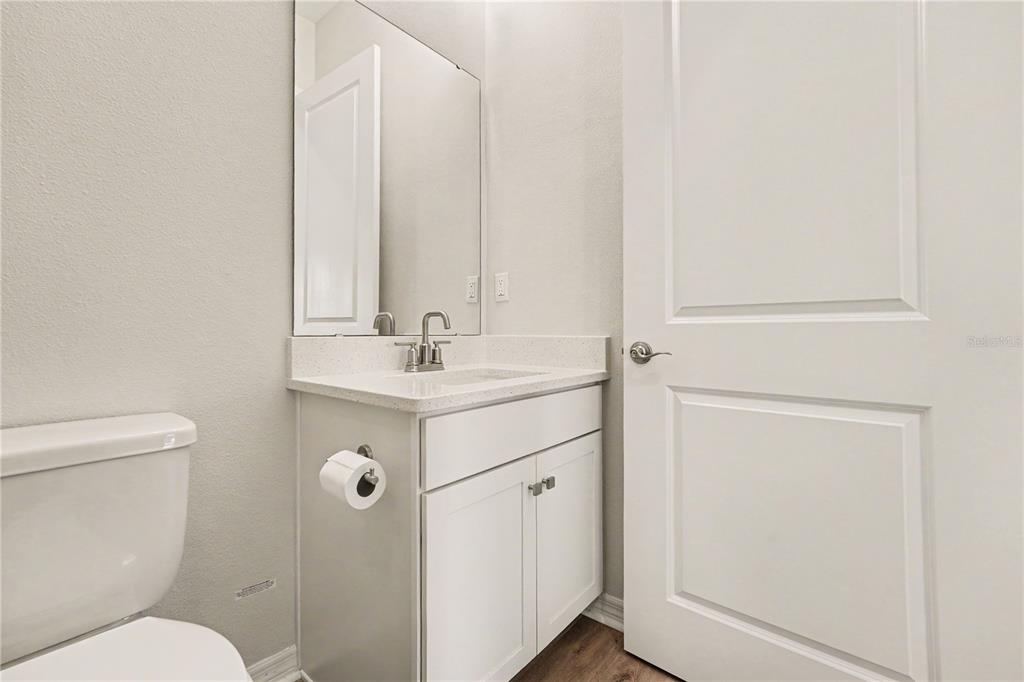 1991 Key Bay Trail Kissimmee, FL 34747 - Photo 22 of 31 a bathroom with a sink mirror and toilet