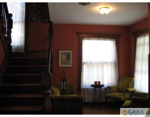 340 New Market Road Dunellen, NJ 08812 - Photo 2 of 8 a living room with furniture and a large window