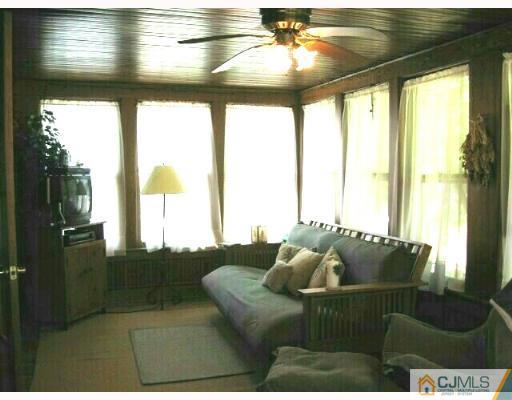 340 New Market Road Dunellen, NJ 08812 - Photo 6 of 8 a living room with furniture and floor to ceiling window