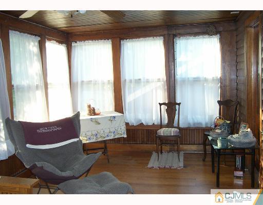 340 New Market Road Dunellen, NJ 08812 - Photo 7 of 8 a living room with furniture and a large window