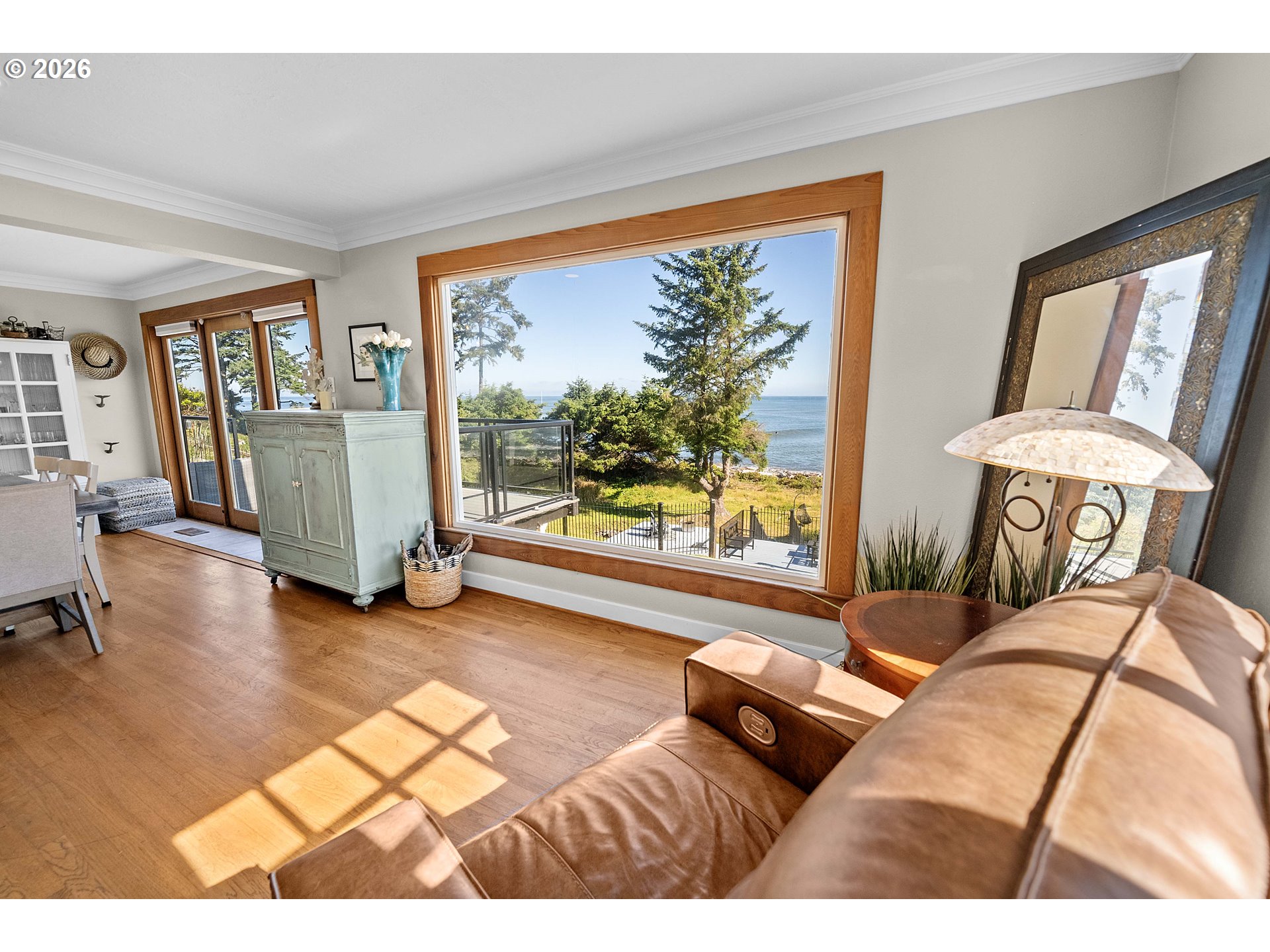 3232 Sunset Boulevard Seaside, OR 97138 - Photo 5 of 48 a bedroom with a bed and large windows