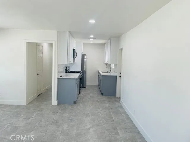 a view of a kitchen with a sink