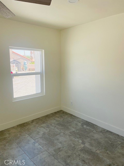 73882 Santa Rosa Way Palm Desert, CA 92260 - Photo 6 of 11 an empty room with a window