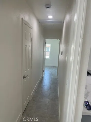 a bathroom with a sink a toilet and a window