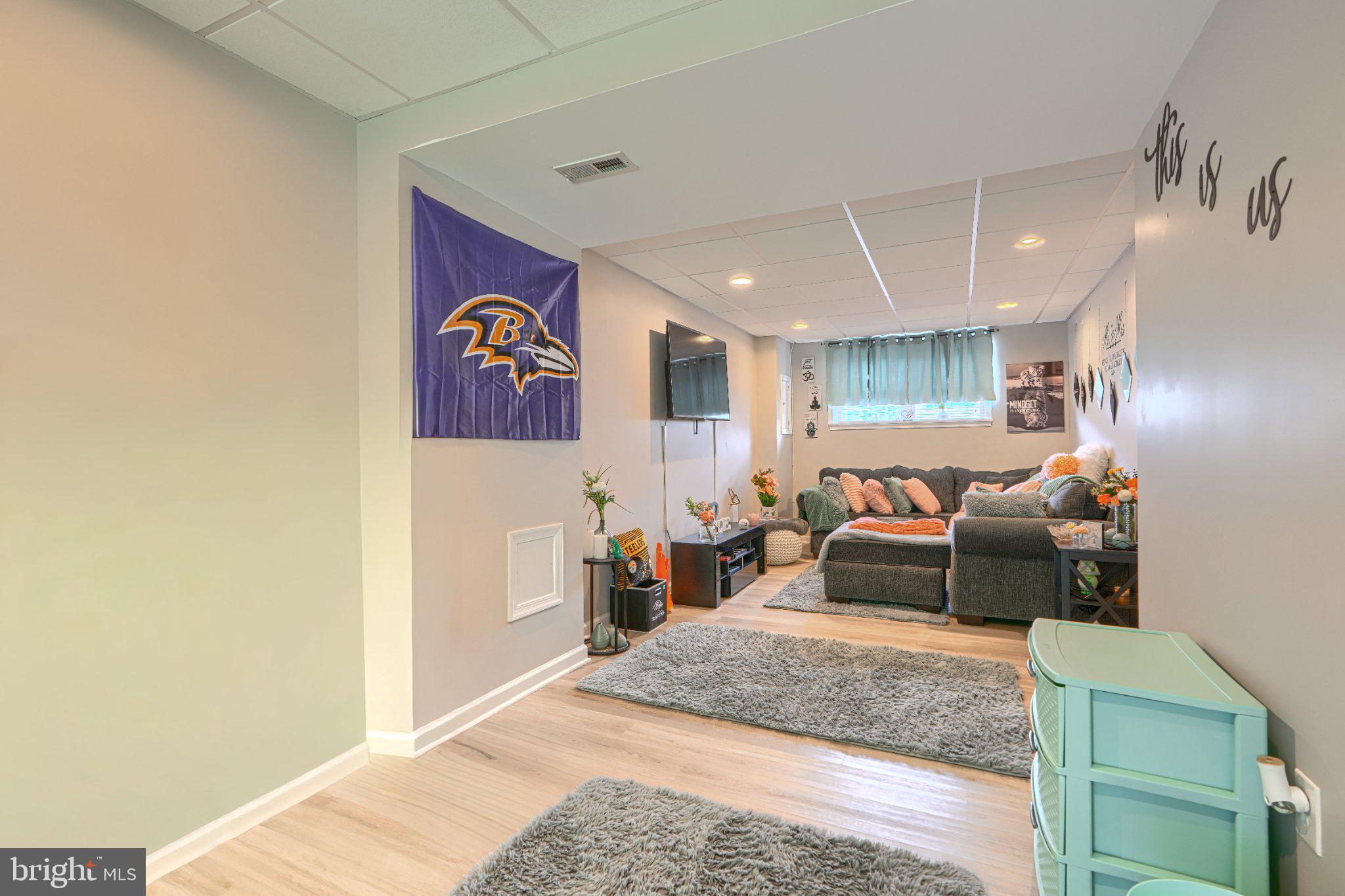 4067 Rustico Road Baltimore, MD 21220 - Photo 27 of 31 Cozy basement retreat with team spirit.